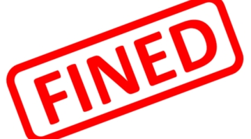 white background with red capitals saying FINED
