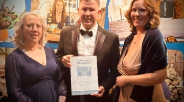 photo of Linda Baker, Tom Dodd and Lara Rowe holding a certificate