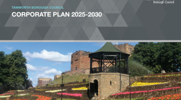 Front cover of the corporate plan. Has a grey heading with the title at the top and then below is picture of the bandstand in front of the castle with coloured flowers