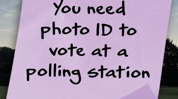 A purple post it note with the text 'you need photo ID to vote at a polling station'