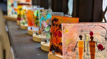 a window displaying various glass artwork 