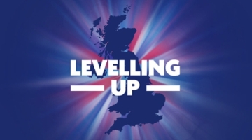 A map image of the UK with the words 'levelling up' on the top in white capital letters