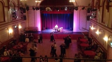 old photo of a dance floor in a theatre auditorium 