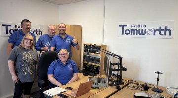 photo of a group of people near a wooden desk