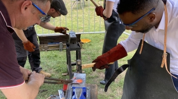 People in a blacksmith workshop